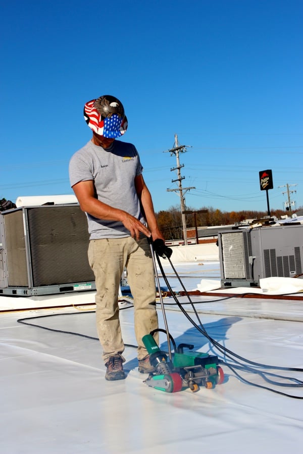 Aaron_using_walk_behind_welder.jpg